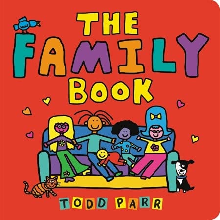 The cover of The Family Book by Todd Parr.  A family with two parents, a baby, a preschooler and an older child sit on a couch.  An orange striped cat sits on one side of the couch and a black-and-white dog sits on the other side.