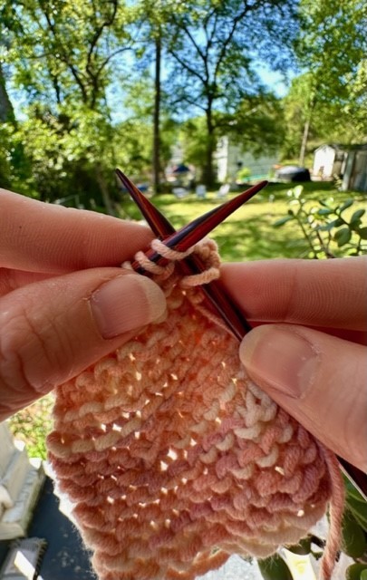 Practicing the basic knit stitch