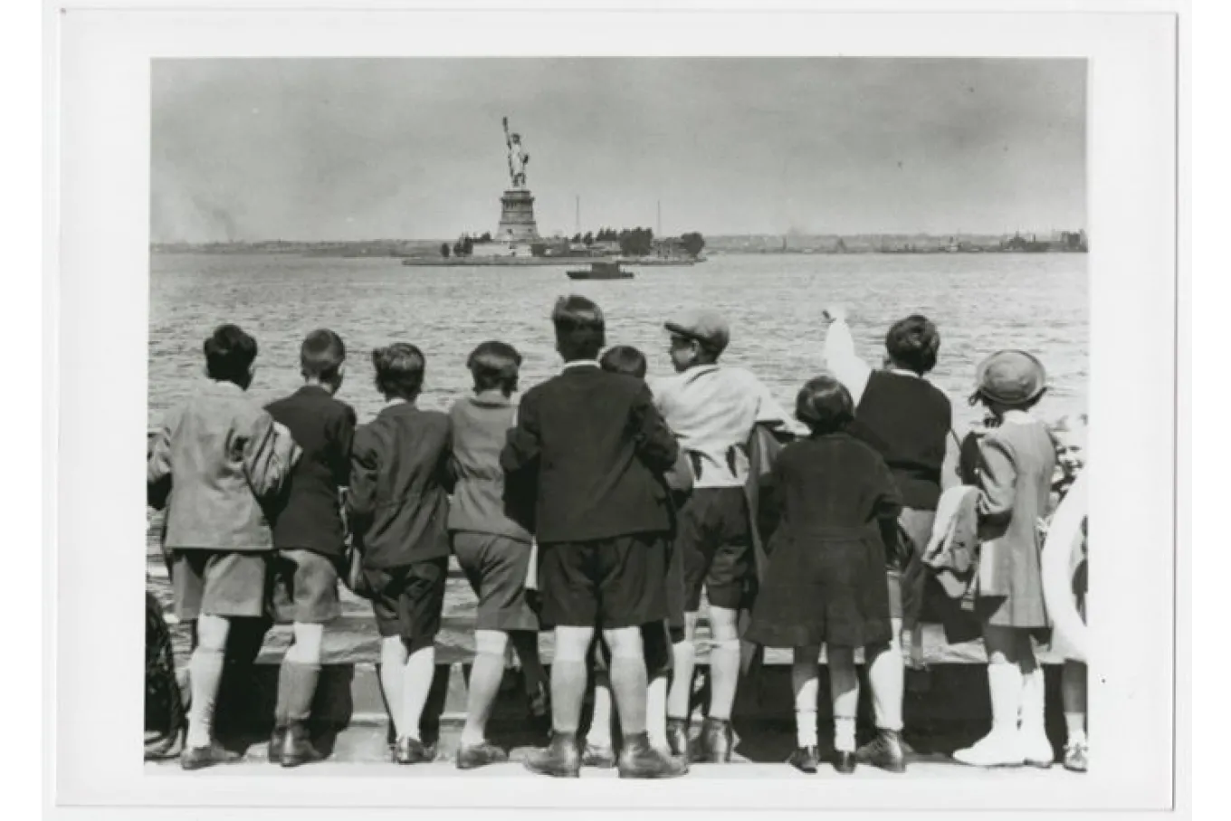 Children aboard the President Harding look at the Statue of Liberty